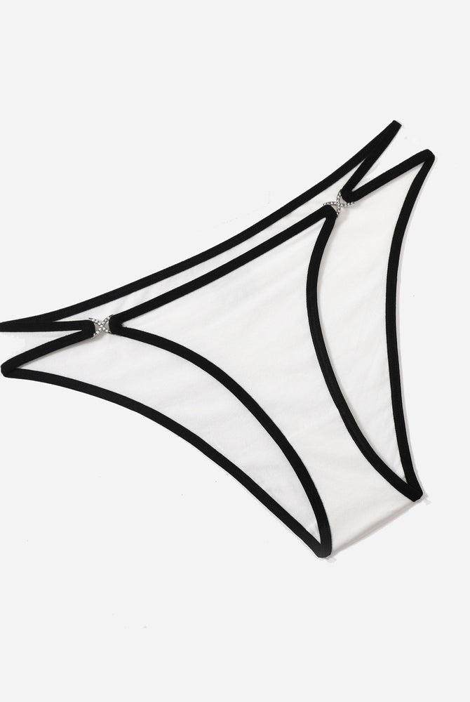 White sheer thong panty with black trim and rhinestone accents, low rise design, sensual lingerie.