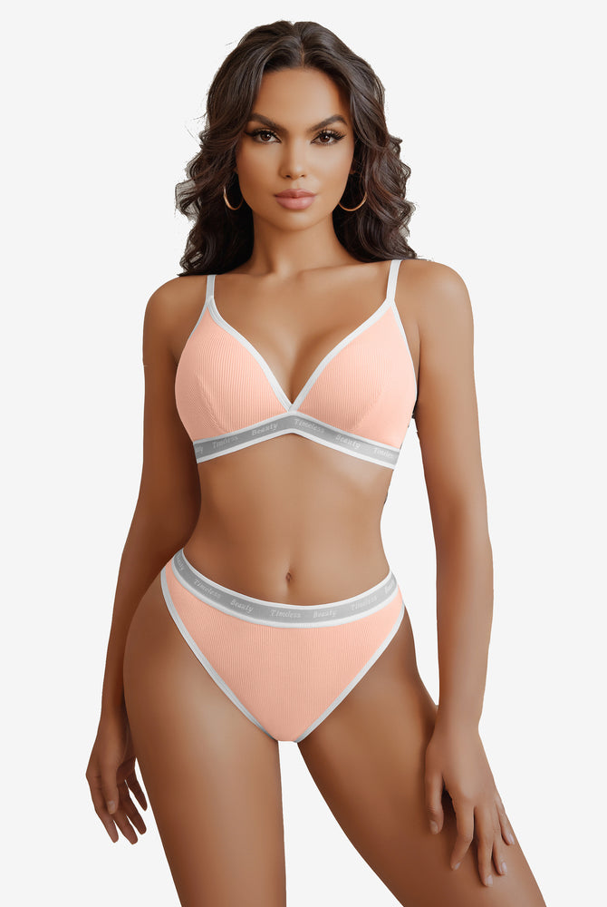Peach ribbed knit contrast lingerie set with white trim and "Timeless Beauty" print
