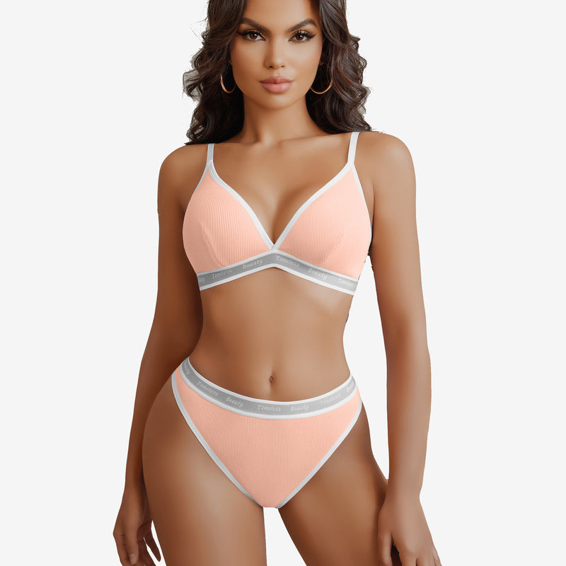 Peach ribbed knit contrast lingerie set with white trim and "Timeless Beauty" print