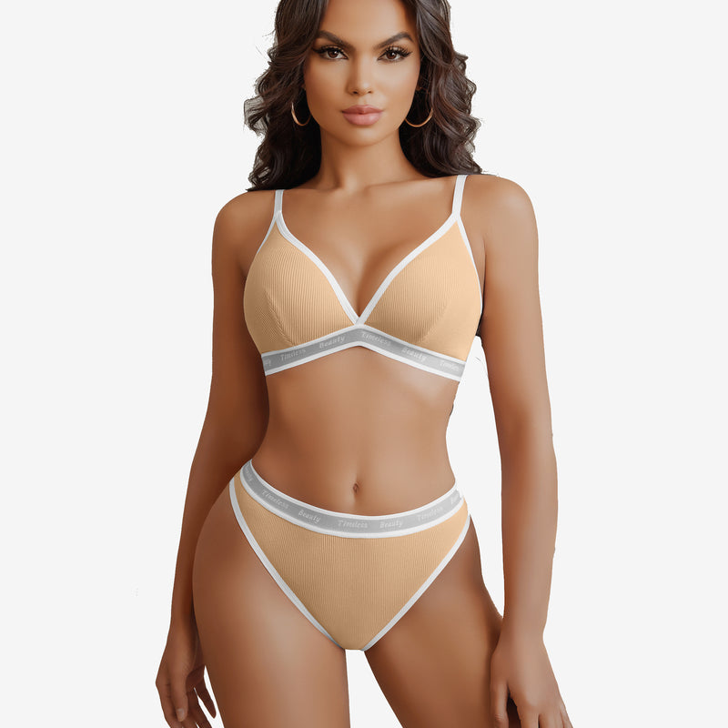 Light orange ribbed knit lingerie set with "Timeless Beauty" print, white trim, adjustable straps.