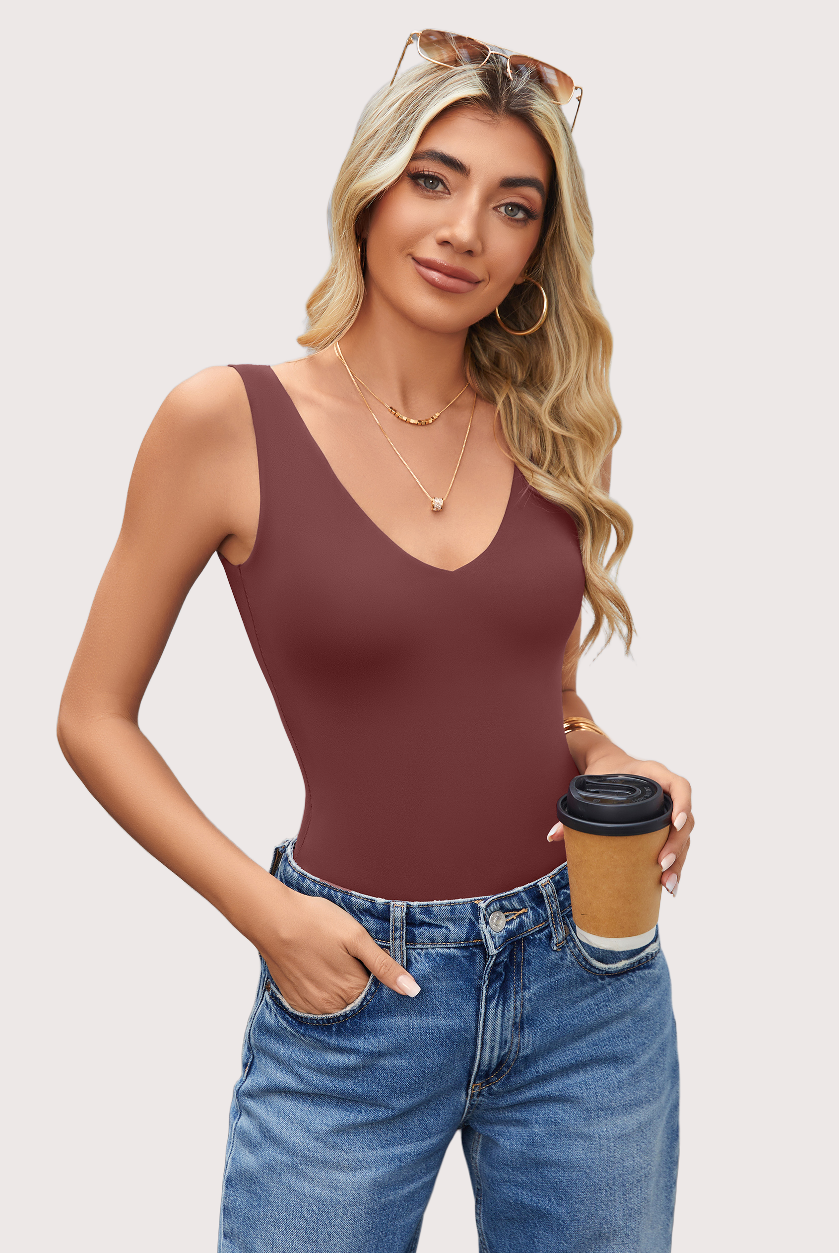 Burgundy double-lined bodysuit leotard with plunging V-neck, paired with blue jeans, a must-have.
