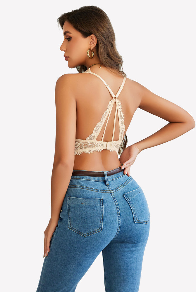Beige lace bralette with racerback design, paired with jeans. Comfortable and stylish.