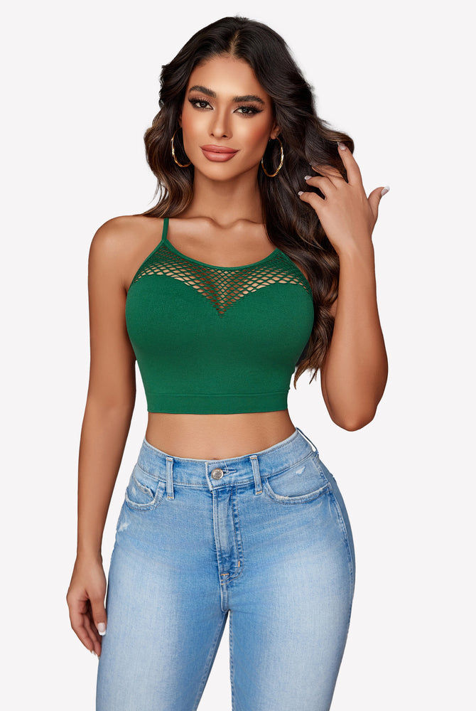Green fishnet crop top Y2k bralette with mesh detail, showing attractive curves, paired with jeans