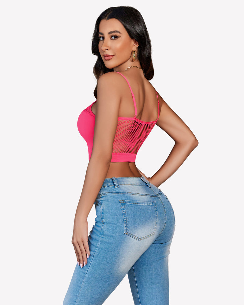 Pink fishnet crop top Y2k bralette with mesh detail, paired with light blue jeans, showing curves.