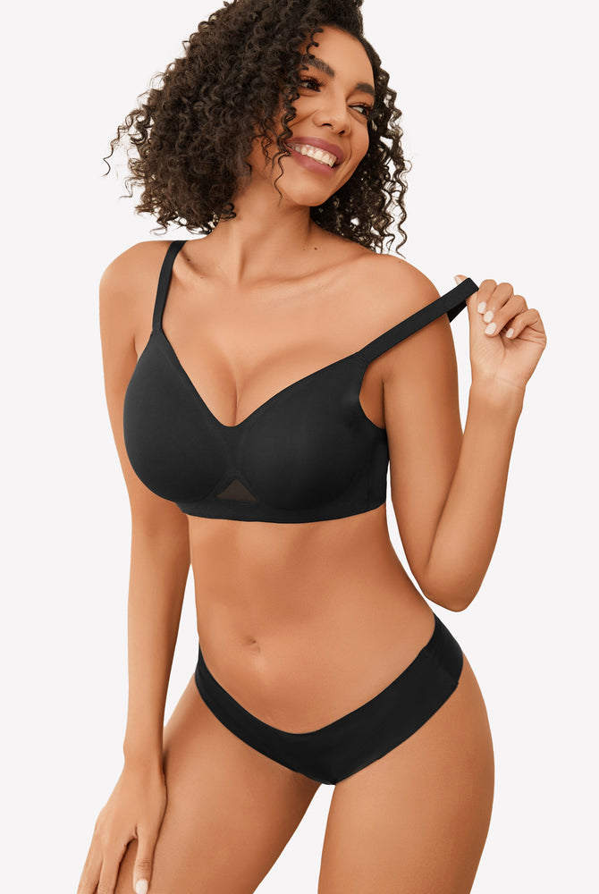 Black seamless wireless bra with soft support and full coverage. Model wearing matching underwear.