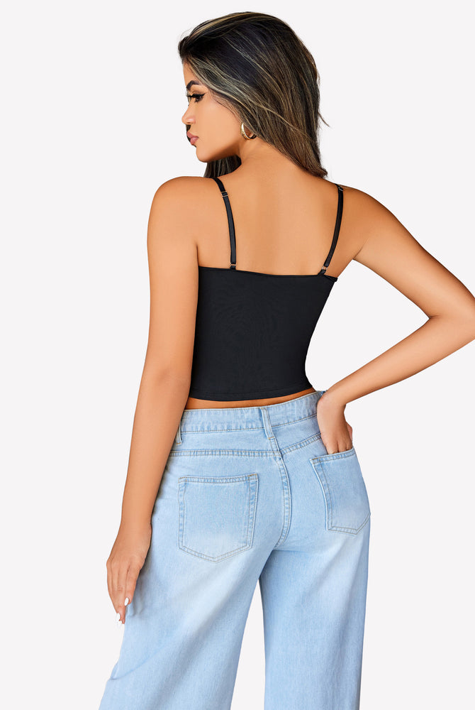 Black ruched camisole crop top with adjustable straps and light blue jeans, a cute outfit.
