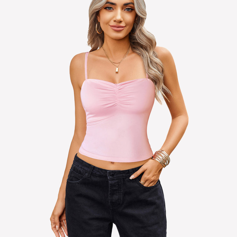 Pink ruched camisole crop top with black jeans, a cute outfit for women.