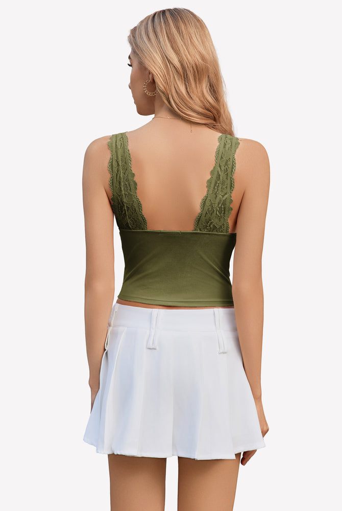 Green lace Y2k tank top with wide straps and white pleated skirt, perfect for going out.