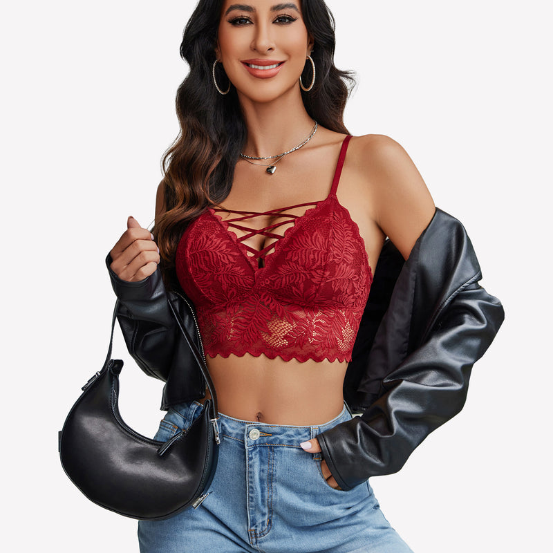 Burgundy lace Y2K camisole tank top with criss-cross straps, light-wash jeans. Floral lace detail.