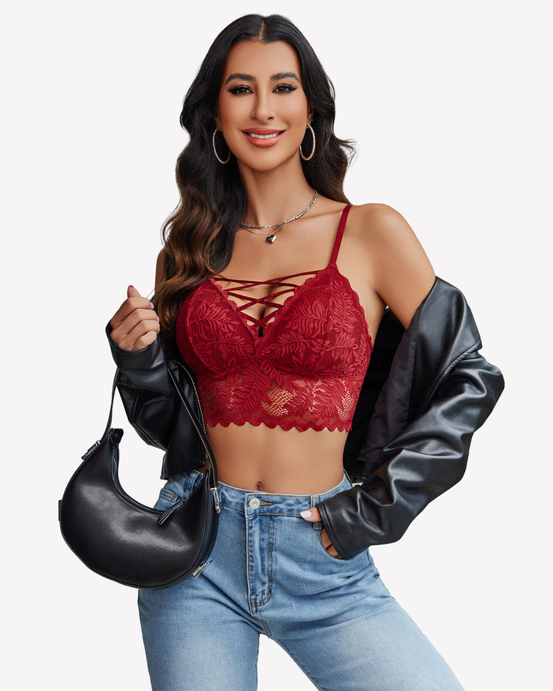 Burgundy lace Y2K camisole tank top with criss-cross straps, light-wash jeans. Floral lace detail.