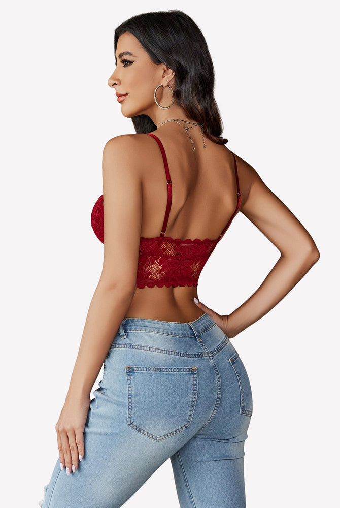 Burgundy lace Y2K camisole tank top with adjustable straps and light-wash jeans. Floral lace detail.