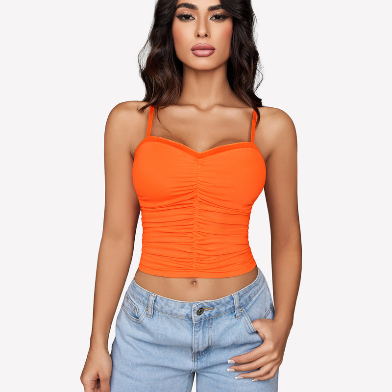 Orange ruched mesh crop top with spaghetti straps, Y2K style, paired with light blue jeans, Avidlove