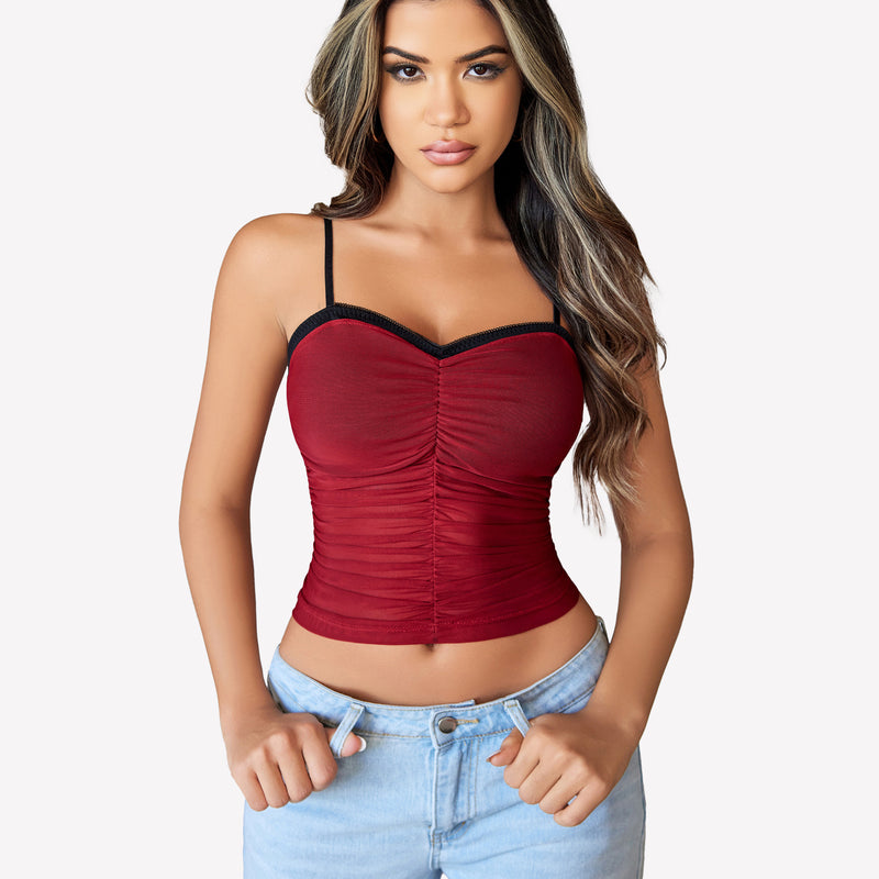 Burgundy ruched mesh crop top with spaghetti straps, Y2K style, paired with light blue jeans