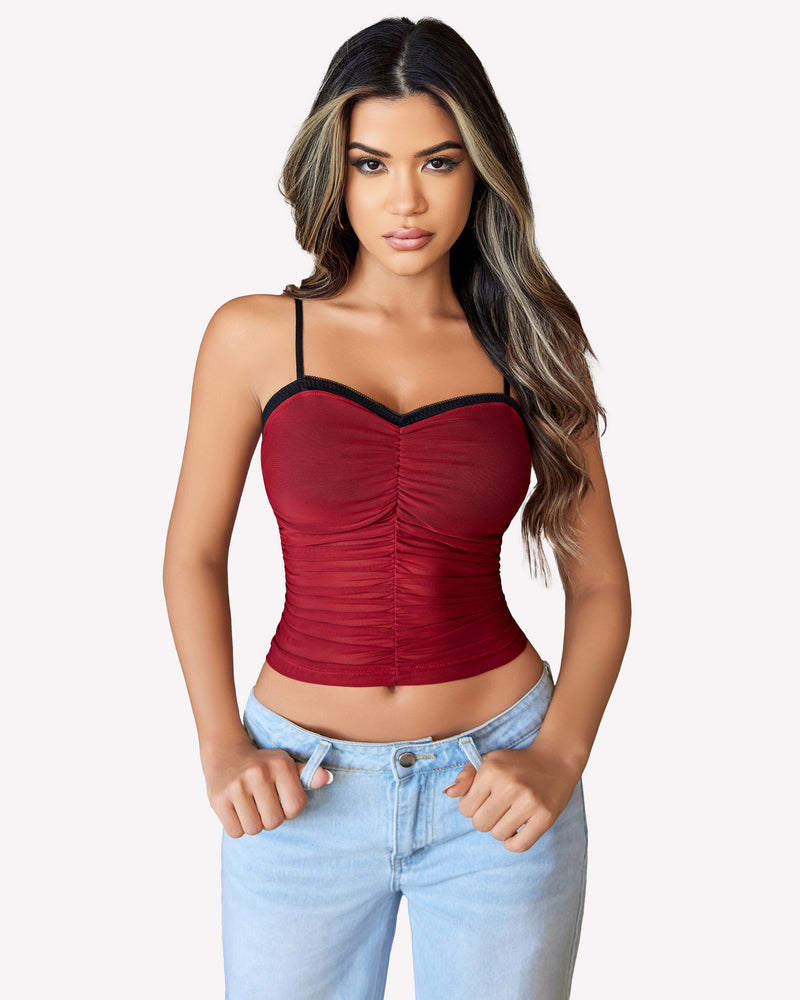 Burgundy ruched mesh crop top with spaghetti straps, Y2K style, paired with light blue jeans