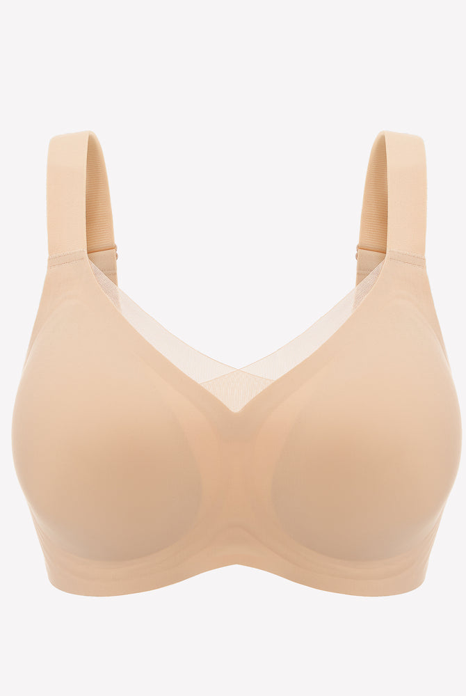 Beige seamless comfort bra with adjustable straps and wire-free design for all-day comfort