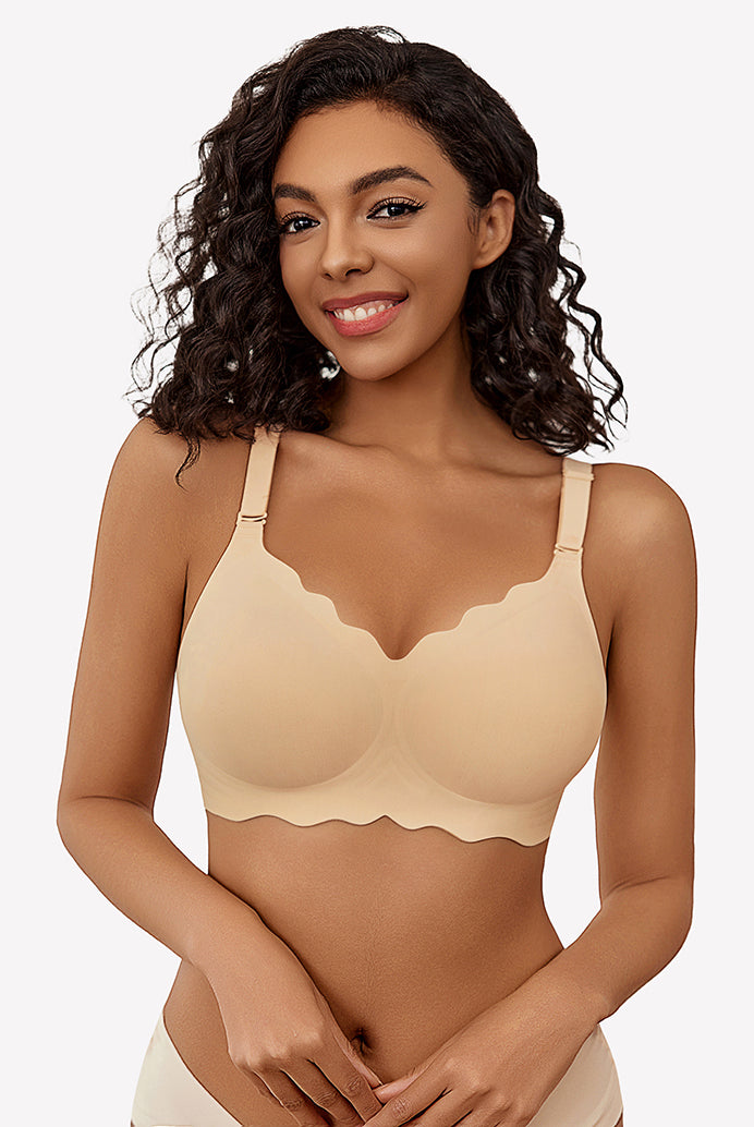 Beige wireless full coverage push up bra with scalloped edges, smiling model.