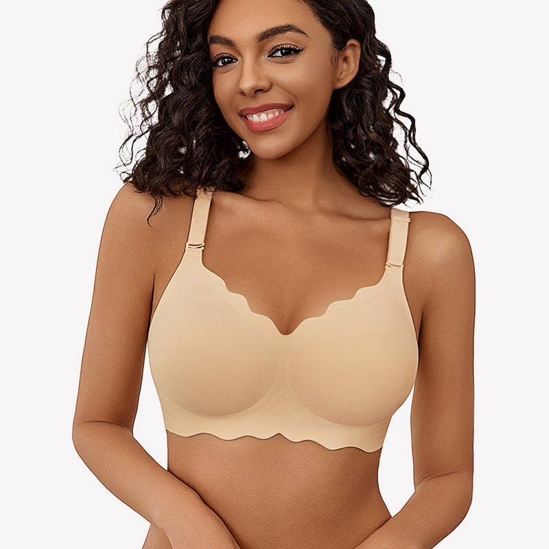 Beige wireless full coverage push up bra with scalloped edges, smiling model.