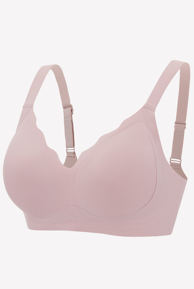 Seamless light pink push-up bralette with adjustable straps for comfort and support, wireless design