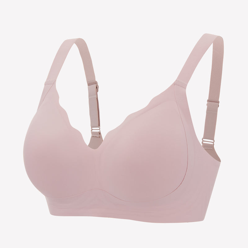 Seamless light pink push-up bralette with adjustable straps for comfort and support, wireless design