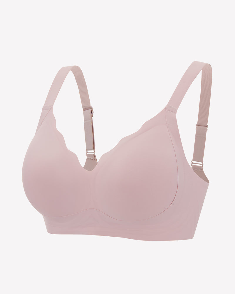 Seamless light pink push-up bralette with adjustable straps for comfort and support, wireless design