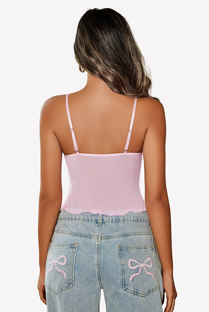 Pink mesh crop top with adjustable straps and Y2K jeans. Summer fashion outfit