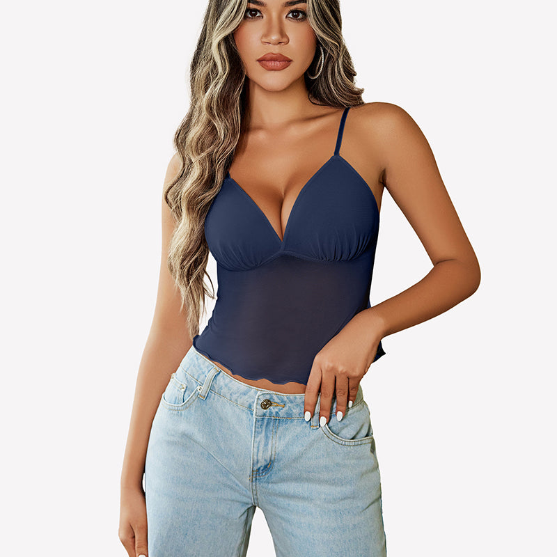 Navy blue mesh crop top with adjustable straps and high-waisted jeans. Y2K summer fashion.