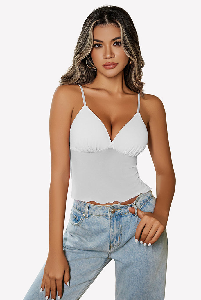 White mesh crop top with adjustable straps and high-waisted jeans. Y2K summer fashion outfit.