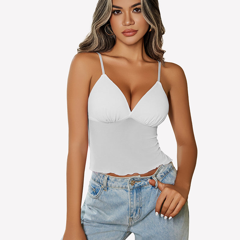 White mesh crop top with adjustable straps and high-waisted jeans. Y2K summer fashion outfit.
