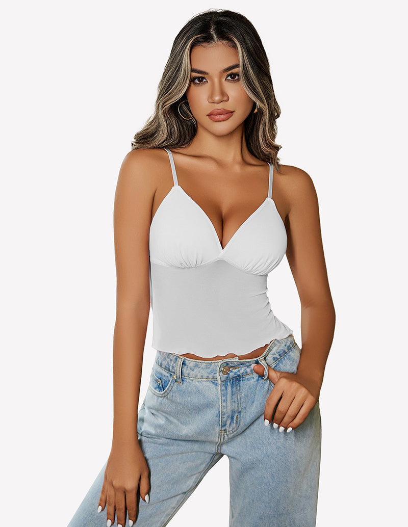 White mesh crop top with adjustable straps and high-waisted jeans. Y2K summer fashion outfit.