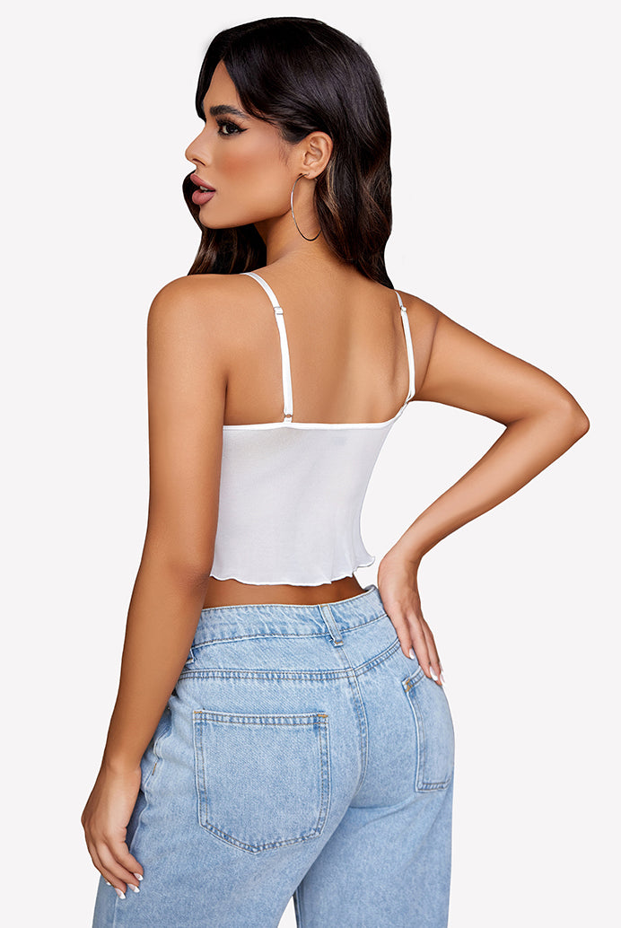 White mesh Y2K crop top with adjustable straps, paired with jeans. Trendy summer tank top.