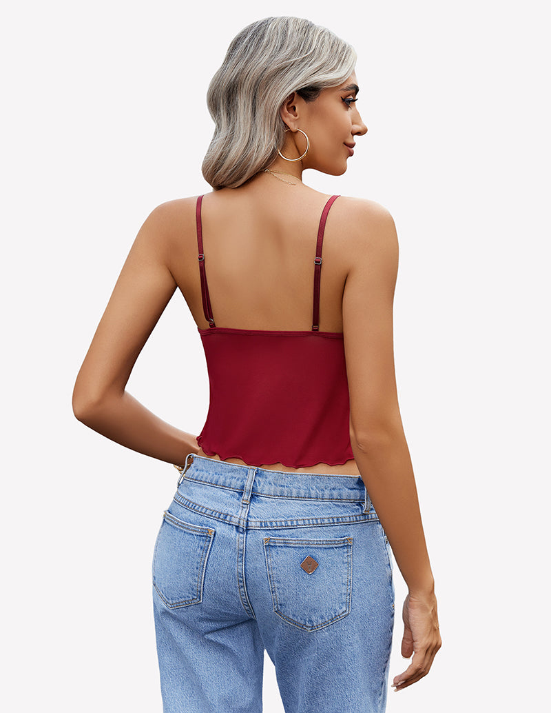 Burgundy crop top with adjustable straps and high-waisted jeans. Y2K summer fashion outfit.