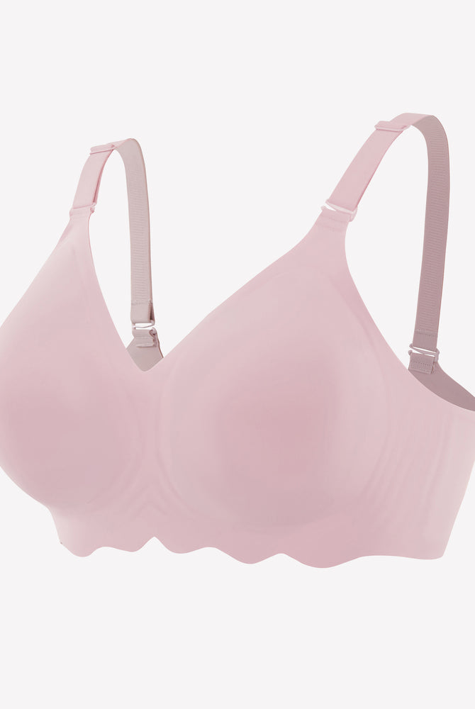 Pink seamless wireless bralette with adjustable straps and petal edge design.