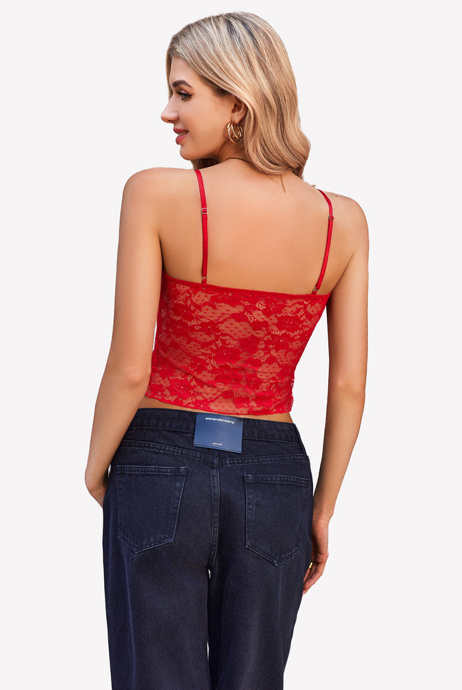 Red lace cami top with thin straps and dark-wash jeans. Y2K style cami top.