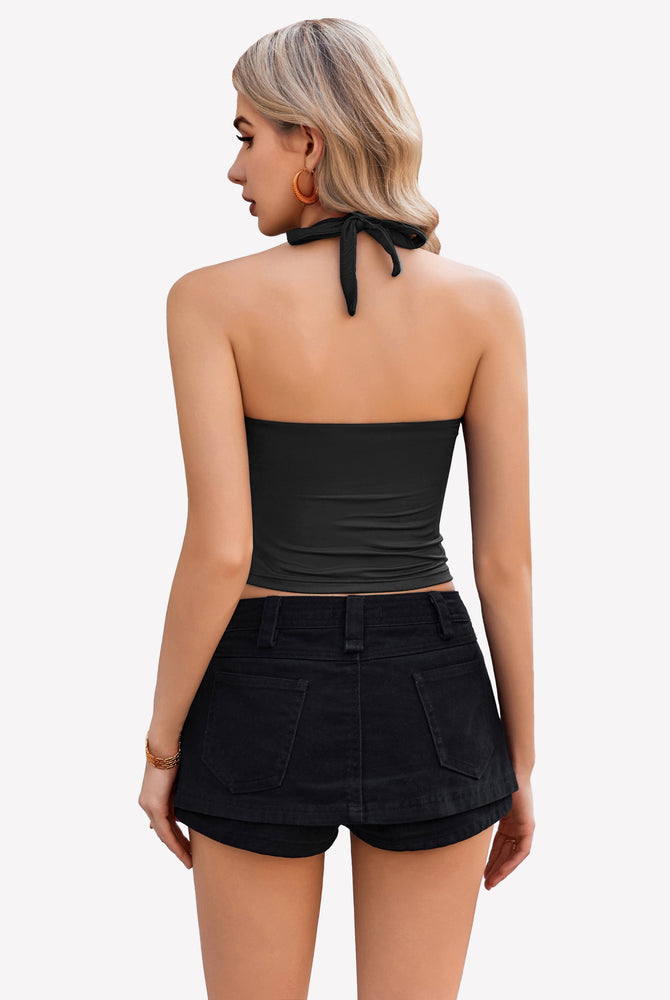Black halter crop top with backless design, perfect for going out, paired with black denim shorts