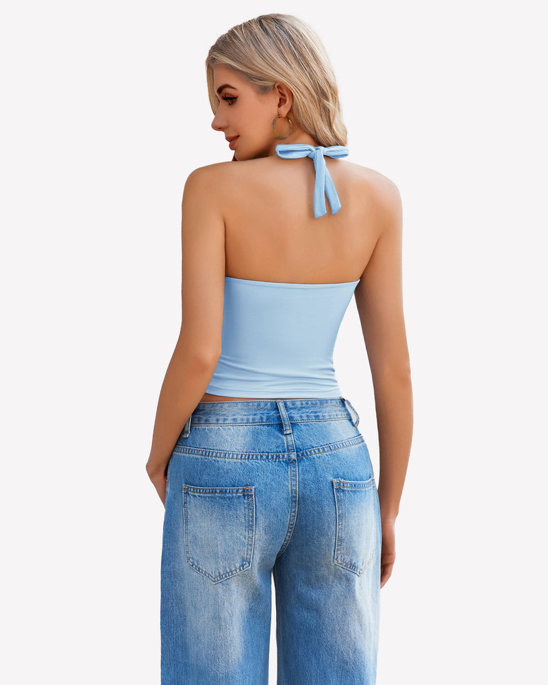 Light blue halter crop top with backless design, paired with denim jeans. Perfect for a night out.