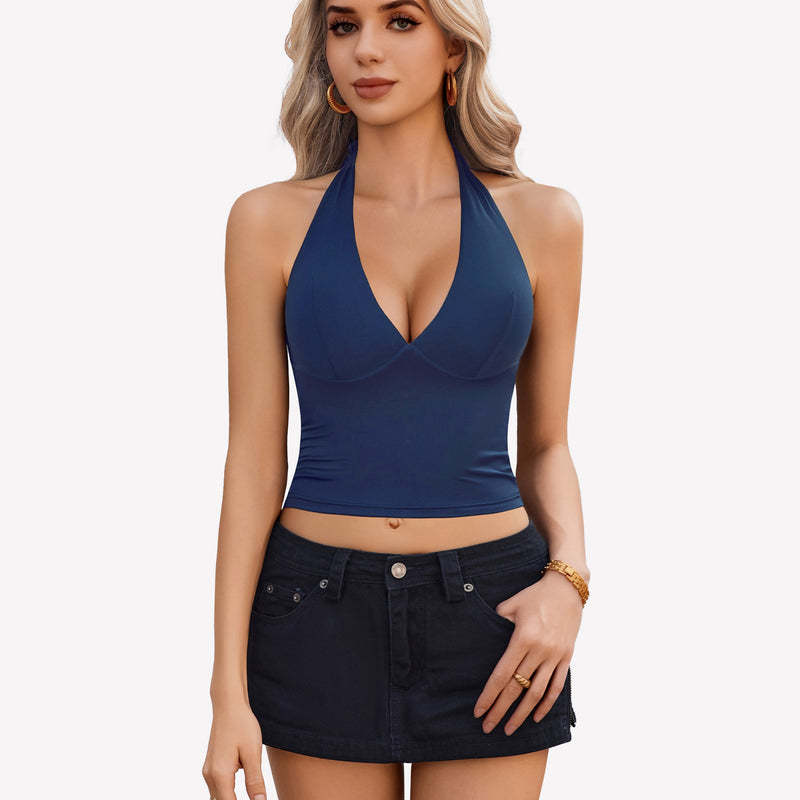 Navy blue halter crop top with plunging V-neck, backless design, black denim skirt. Going out.