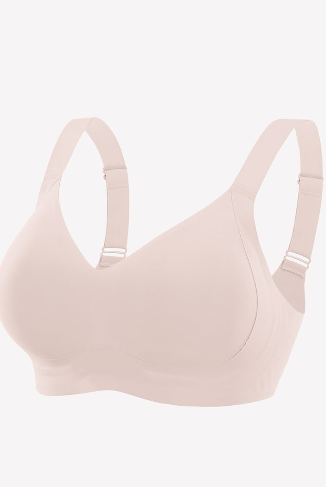 Seamless blush pink bra. Smooth, comfortable fit. Adjustable straps, no underwire, silky feel.