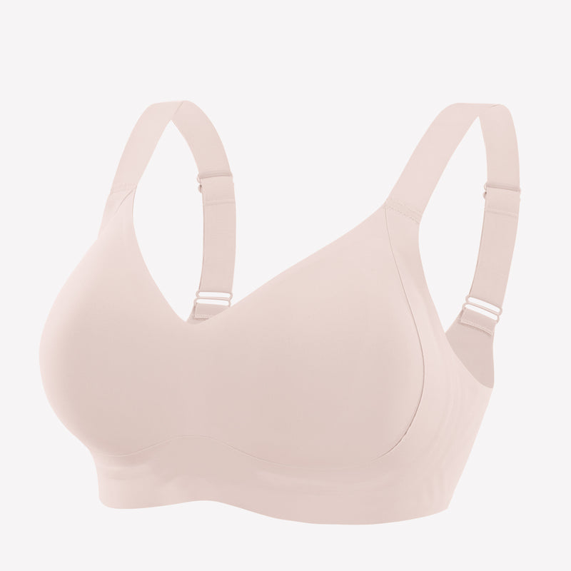 Seamless blush pink bra. Smooth, comfortable fit. Adjustable straps, no underwire, silky feel.