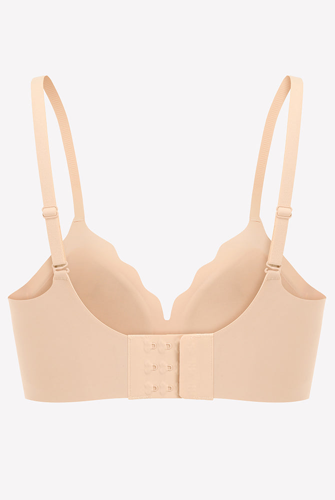 Beige seamless push-up wireless bra with scalloped V-neck design and adjustable straps
