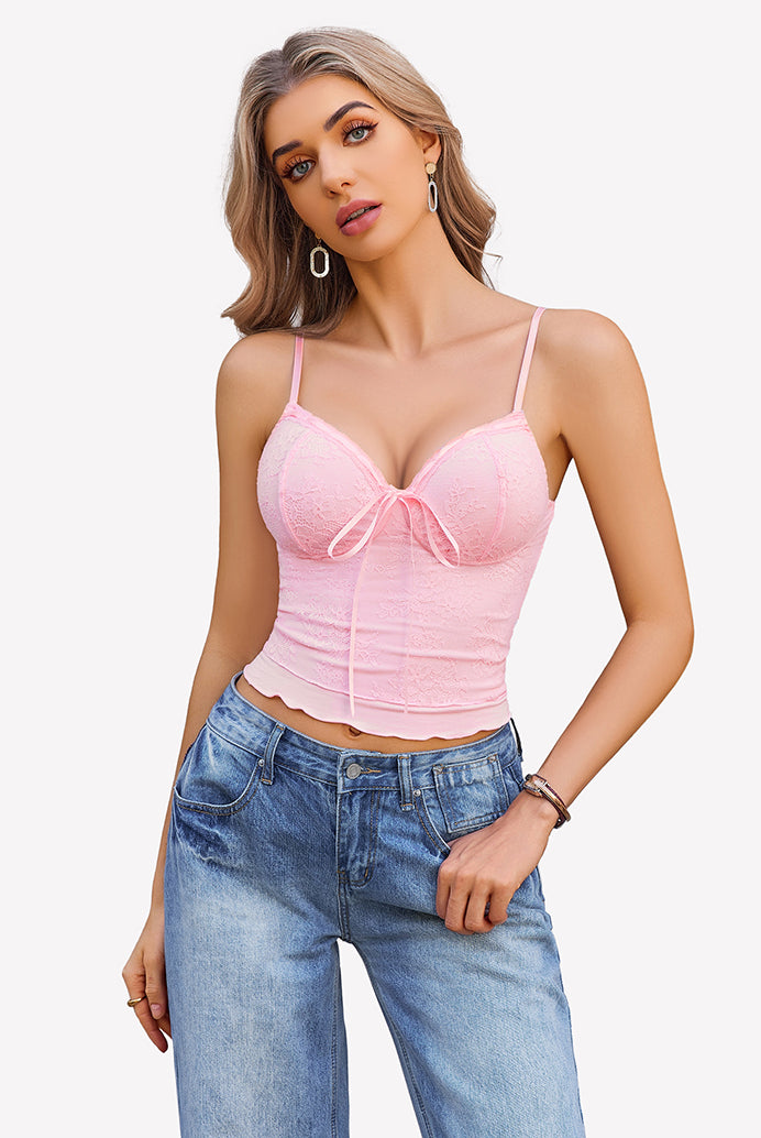 Pink Y2k lace tank top with bow detail, spaghetti straps, light wash jeans. Going out style.