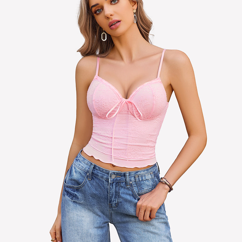 Pink Y2k lace tank top with bow detail, spaghetti straps, light wash jeans. Going out style.