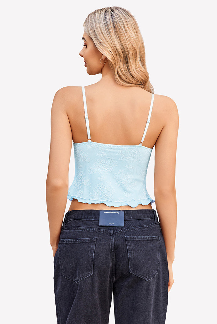 Light blue Y2k lace tank top with spaghetti straps and black denim jeans. Summer going out style.