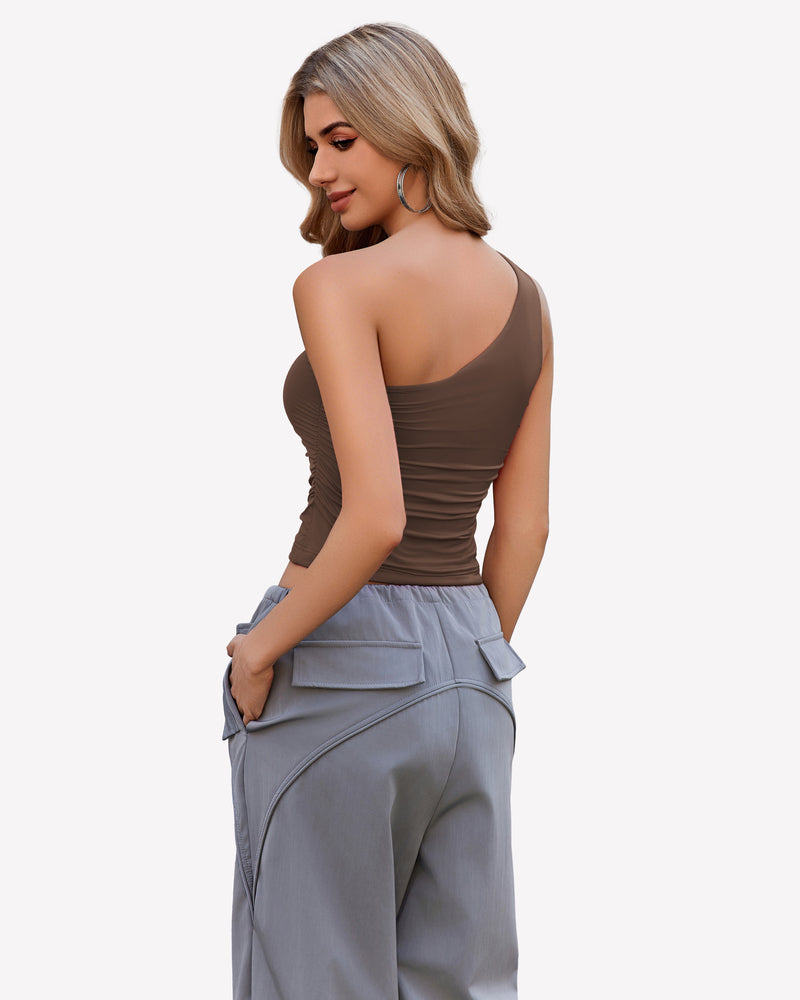 Brown one-shoulder tank top with light gray pants, a stylish and casual outfit for women
