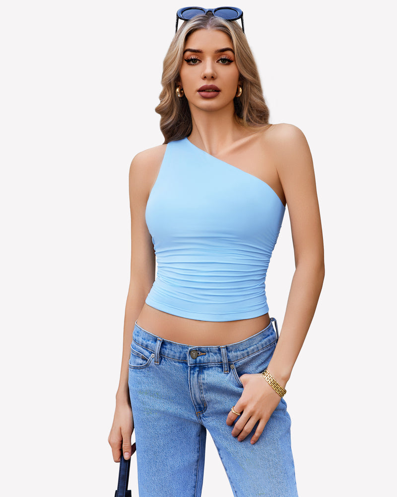 Light blue one-shoulder tank top, ruched design, paired with blue jeans. Stylish crop top.