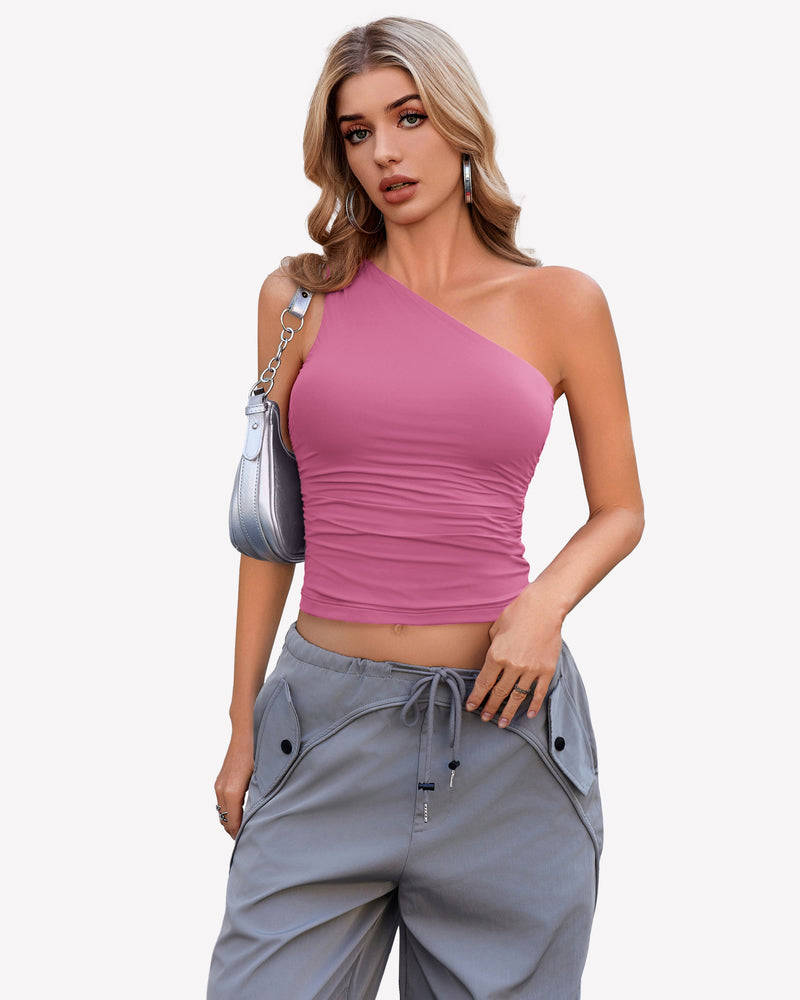 Pink one-shoulder crop top paired with gray cargo pants. Stylish and casual outfit.