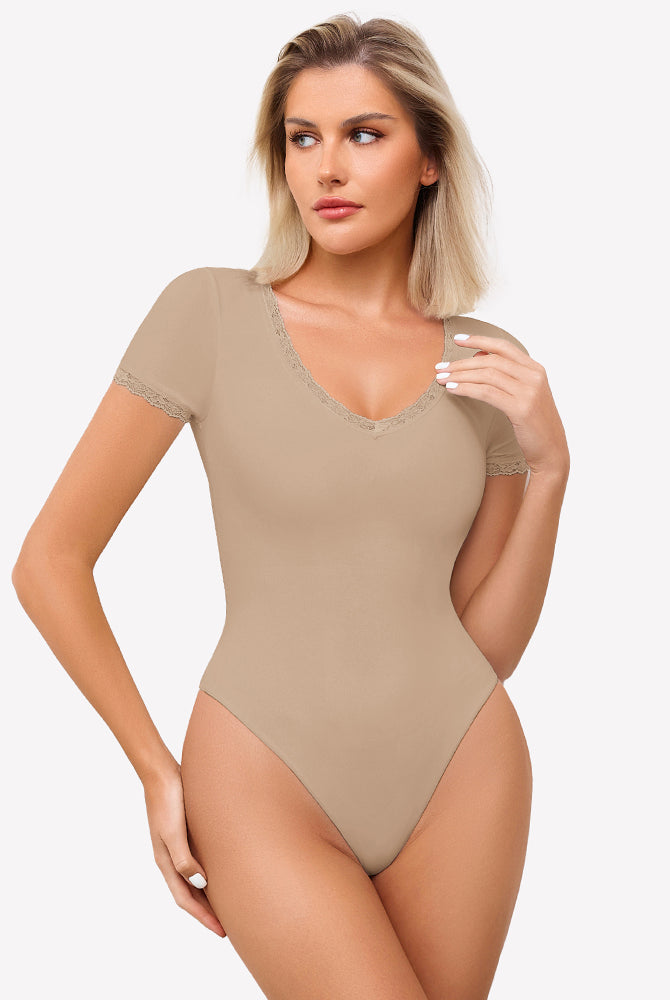 Beige short sleeve V-neck bodysuit with lace trim, light smoothing and flattering fit.