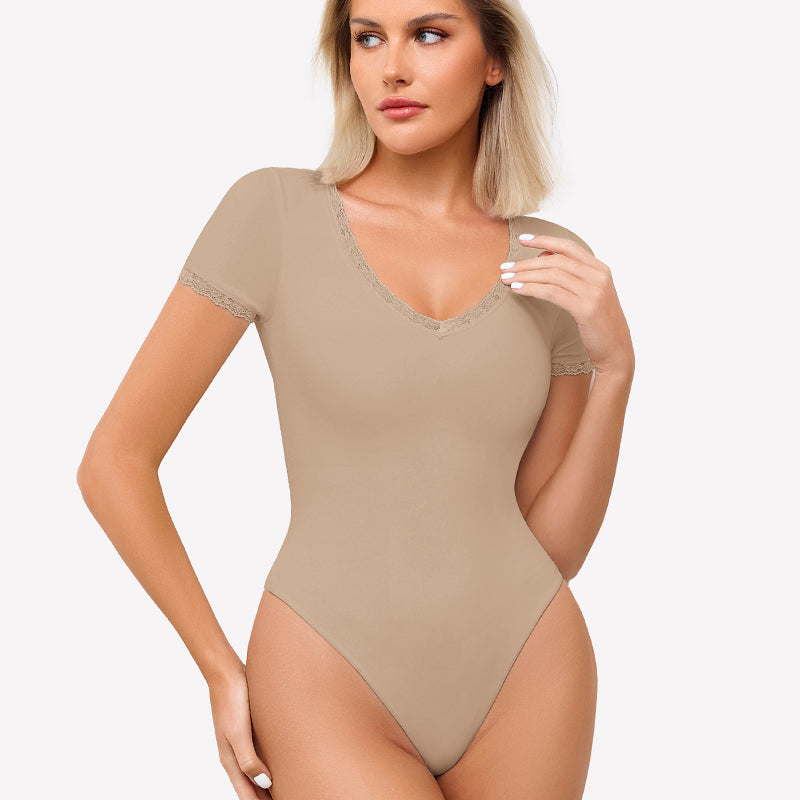 Beige short sleeve V-neck bodysuit with lace trim, light smoothing and flattering fit.