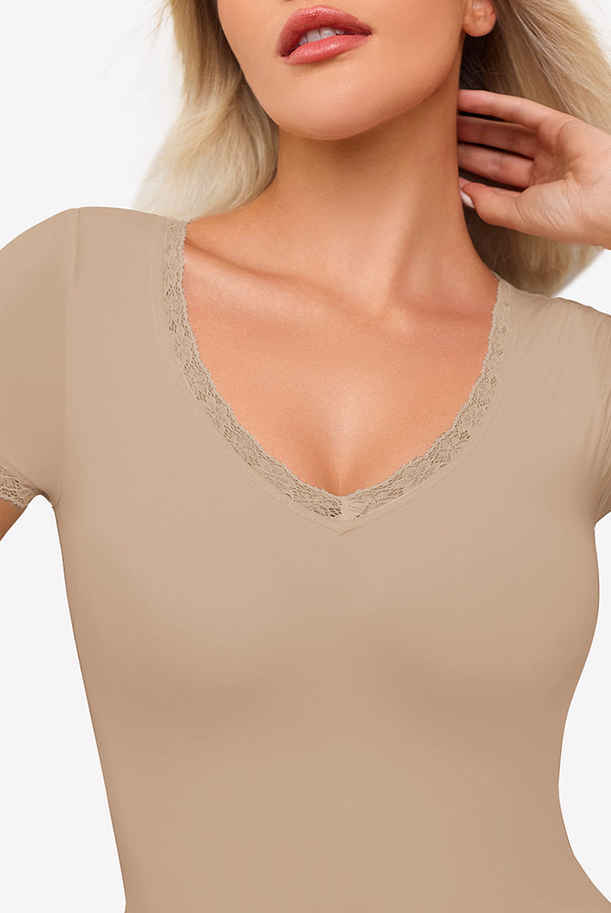 Beige short sleeve V-neck bodysuit with lace trim, offering light smoothing and flattering fit.