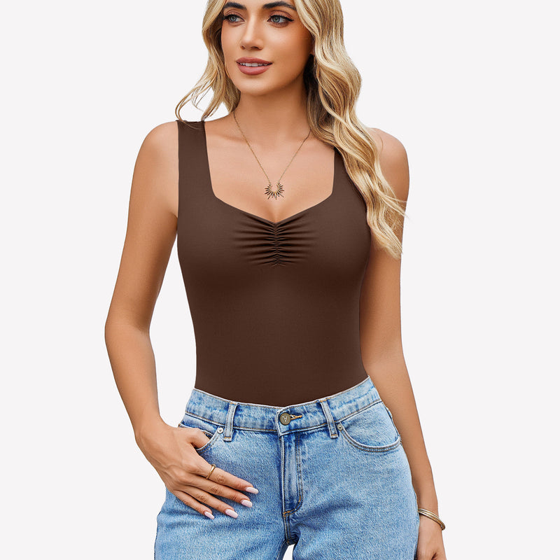 Brown sweetheart neck ruched bodysuit, tank top style, paired with blue jeans. Casual wear.