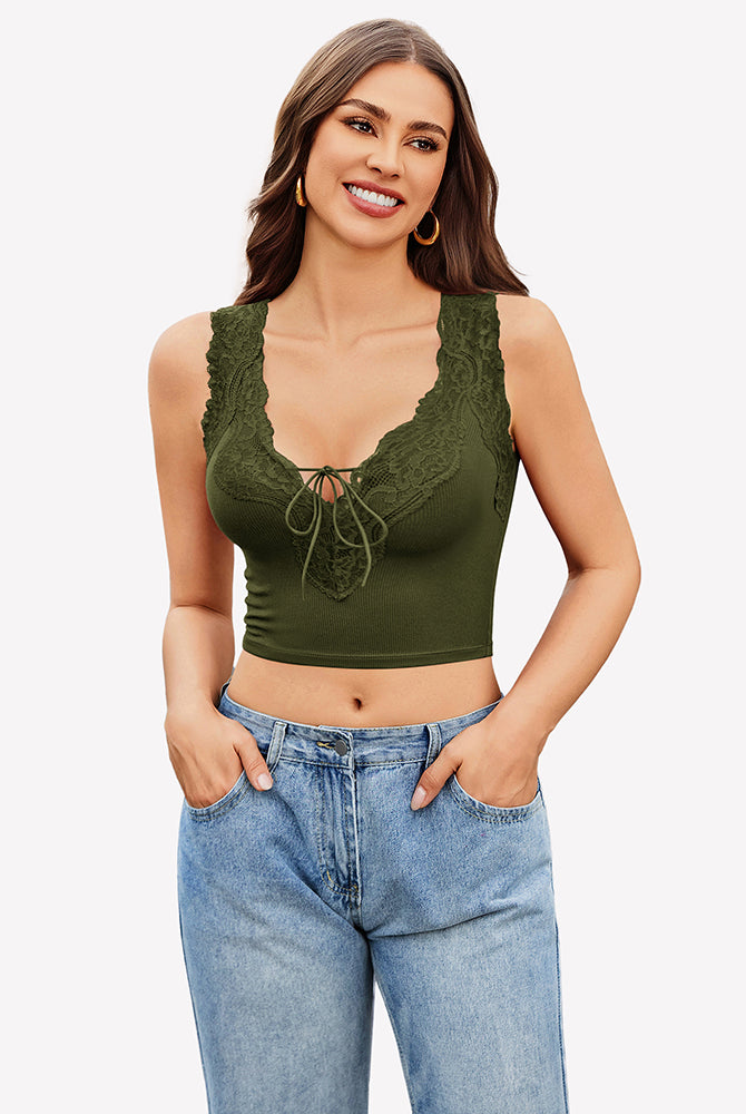 Green V-neck crop top with lace trim and tie-up front, paired with jeans. Sexy and charming style.